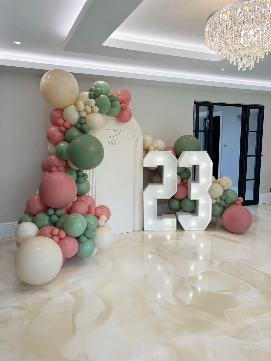 Sage, blush and cream birthday styling with illuminated number twenty-three